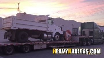 Loading a GMC brigadier truck on a stepdeck trailer.